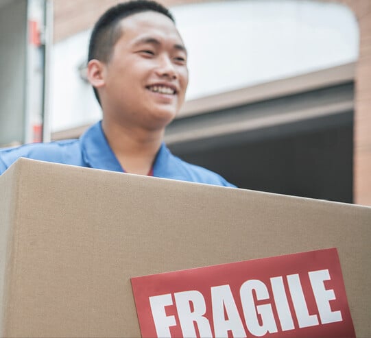 Man carrying a removals box