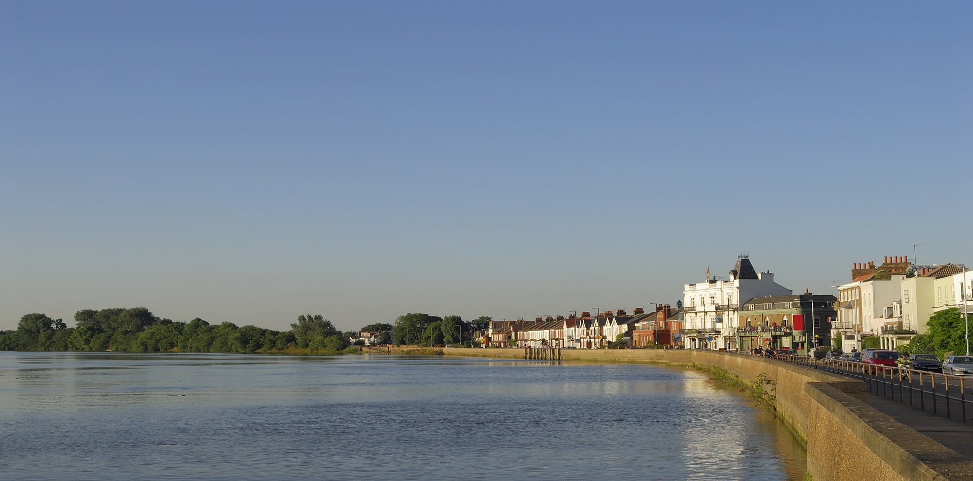 View of the RiverThames, London at Mortlake lit by the evening sun